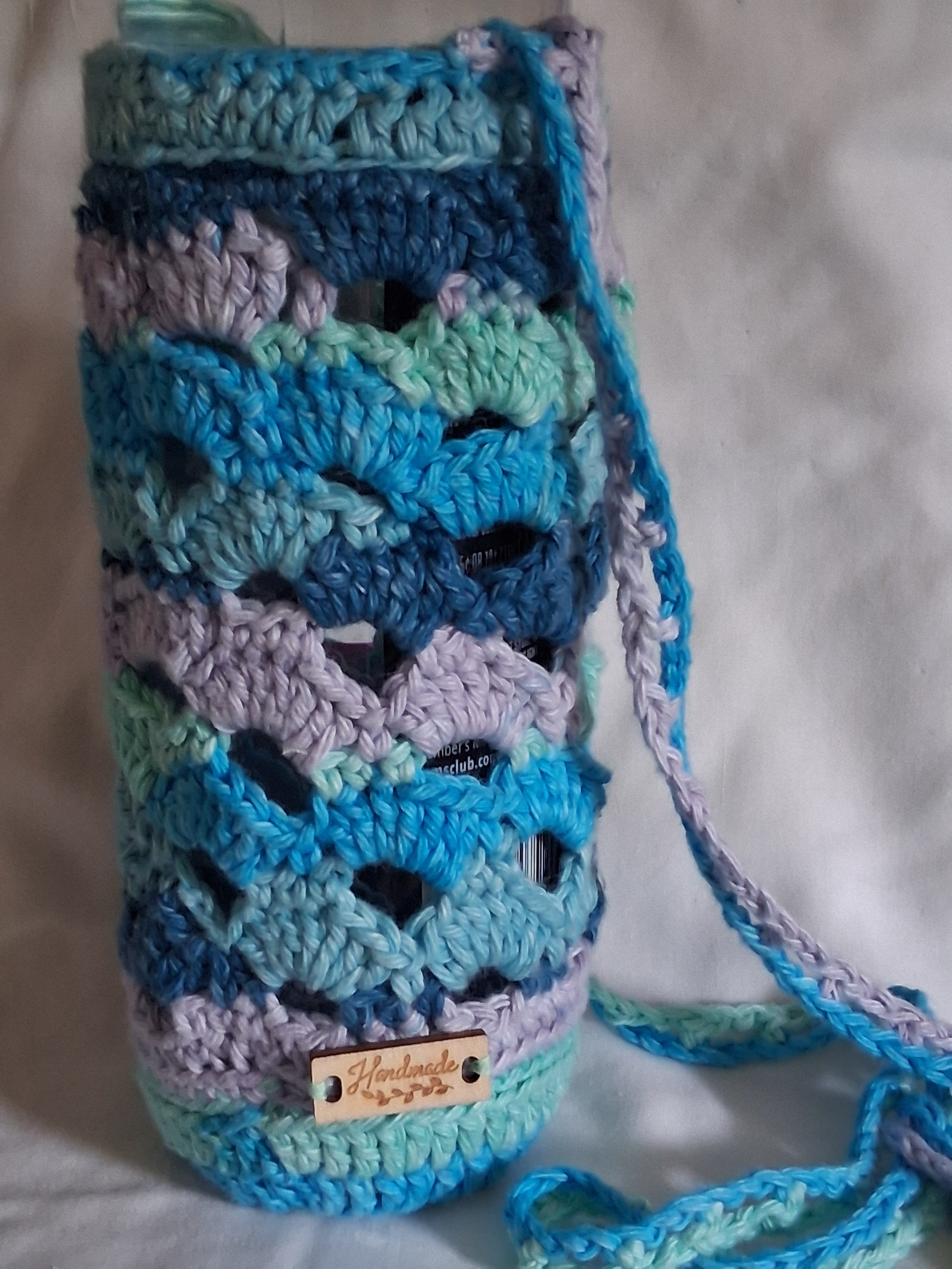Shell stitch water bottle bag for large and small water bottles large or smaller crossbody bags strap and handmade tag accent